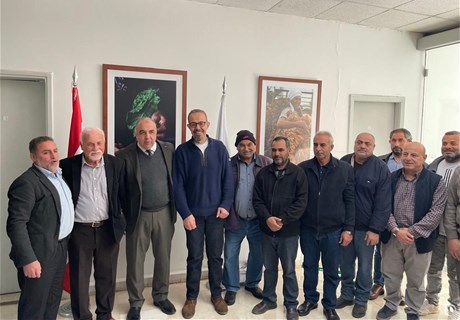 The Regie Distributes Rain Boots to Tobacco Farmers 